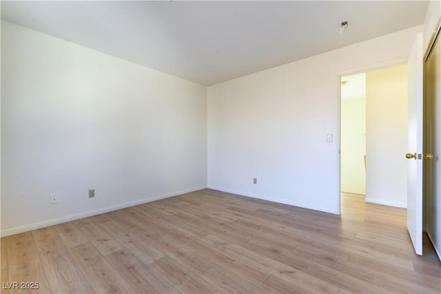 spare room with light hardwood / wood-style floors