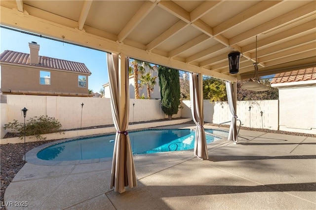 view of swimming pool with a patio area