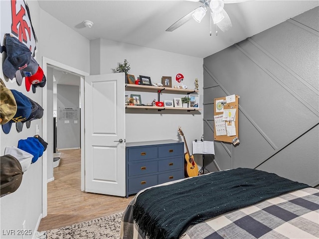 bedroom with ceiling fan and light wood-type flooring