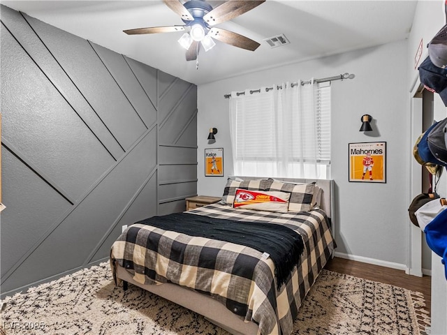 bedroom featuring wood-type flooring and ceiling fan