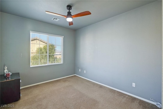 empty room with light carpet and ceiling fan