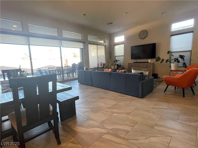 living room with a towering ceiling