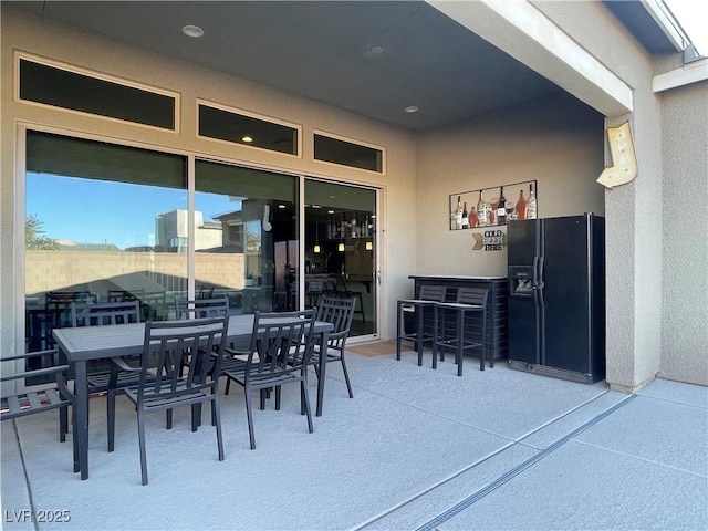 view of patio / terrace featuring a bar