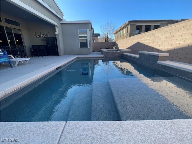 view of swimming pool featuring a patio