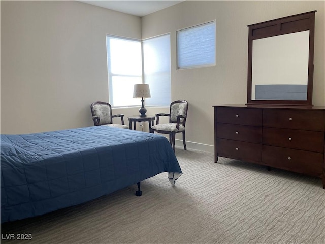 bedroom featuring light colored carpet