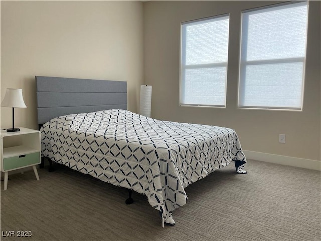 bedroom with dark carpet