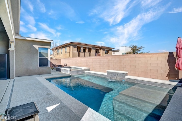 view of pool with a patio area, an outdoor fire pit, a pool with connected hot tub, and a fenced backyard