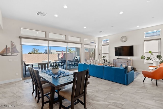 dining room with baseboards, visible vents, a wealth of natural light, and recessed lighting