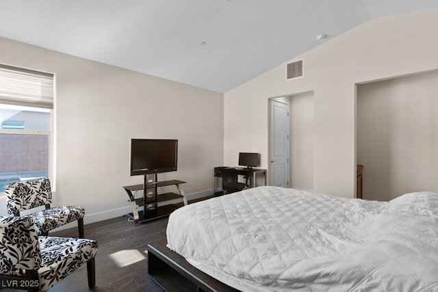 bedroom featuring dark wood-style floors, lofted ceiling, visible vents, and baseboards