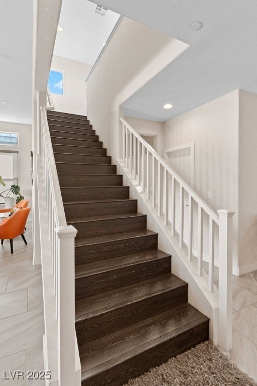 staircase with recessed lighting and visible vents