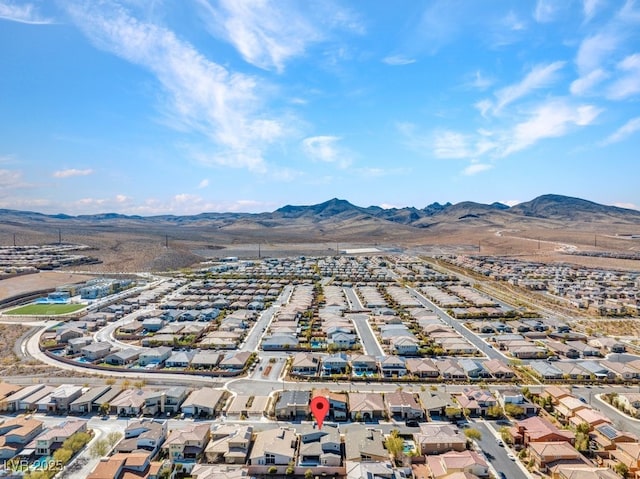 drone / aerial view featuring a residential view and a mountain view