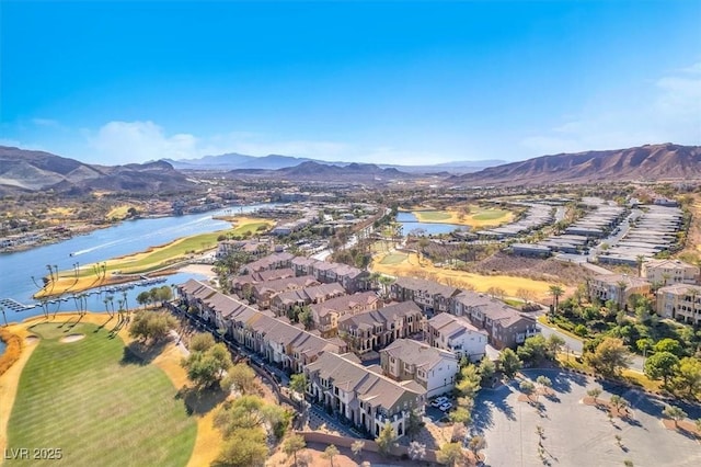 birds eye view of property with a water and mountain view