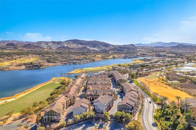 birds eye view of property featuring a water and mountain view