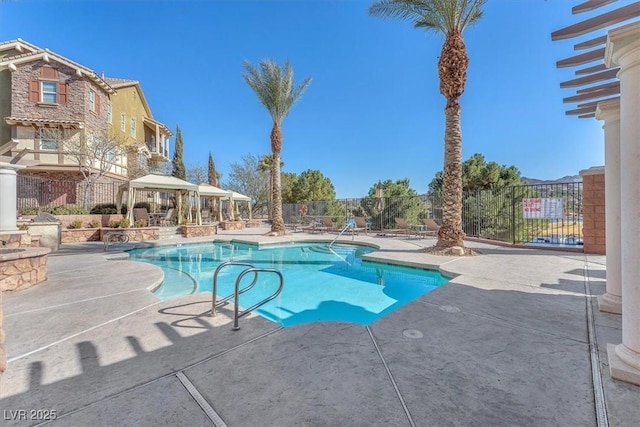 view of swimming pool featuring a gazebo and a patio area