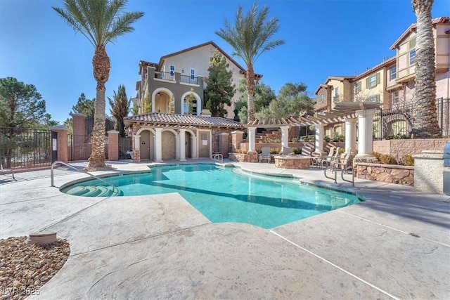 view of pool with a pergola and a patio area