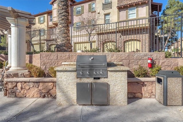 view of patio with a grill and exterior kitchen