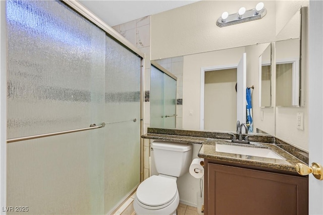 full bath featuring toilet, a stall shower, tile patterned flooring, and vanity