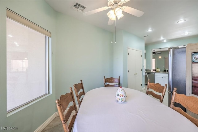 dining space featuring ceiling fan