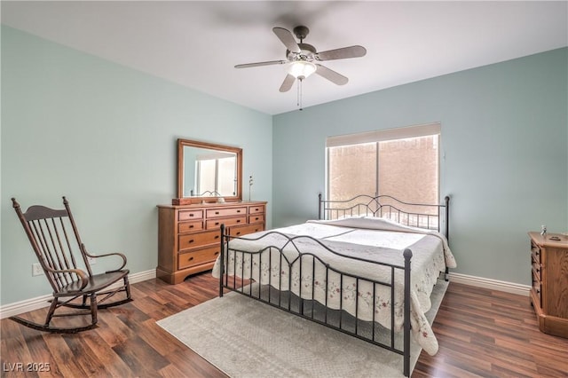 bedroom featuring dark hardwood / wood-style floors and ceiling fan