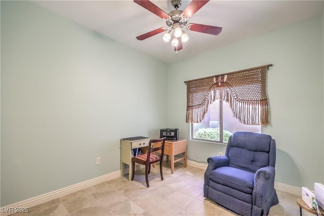 living area with ceiling fan