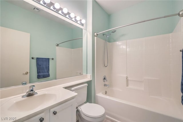 full bathroom with vanity, shower / tub combination, and toilet