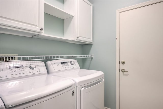 laundry area featuring cabinets and independent washer and dryer