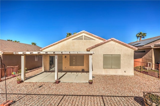 rear view of house featuring a patio