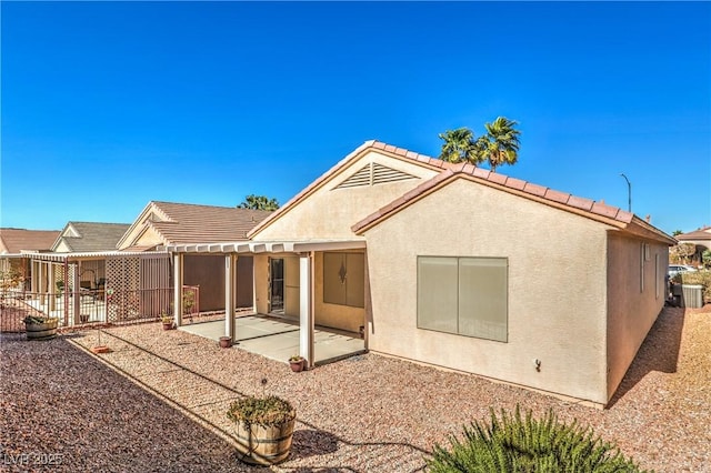 rear view of house with a patio