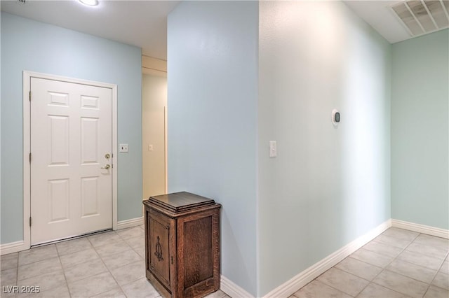 entrance foyer featuring light tile patterned floors