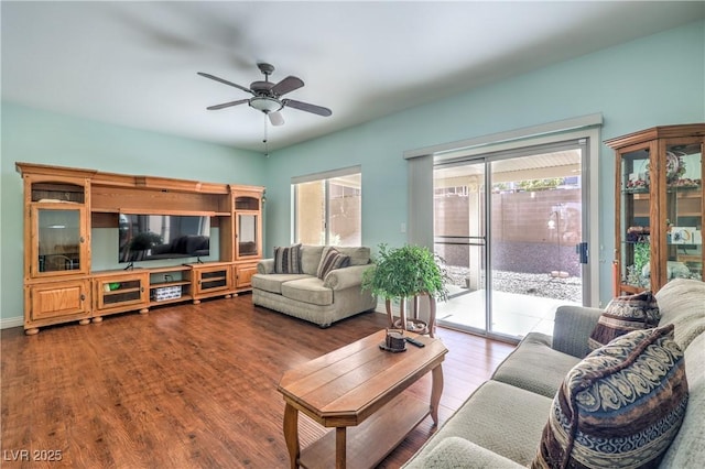 living room with wood-type flooring and ceiling fan