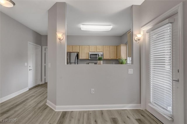 5250 S Rainbow Blvd Unit 2165, Las Vegas, NV 89118 - kitchen featuring stainless steel appliances, light brown cabinetry, and light wood-type flooring