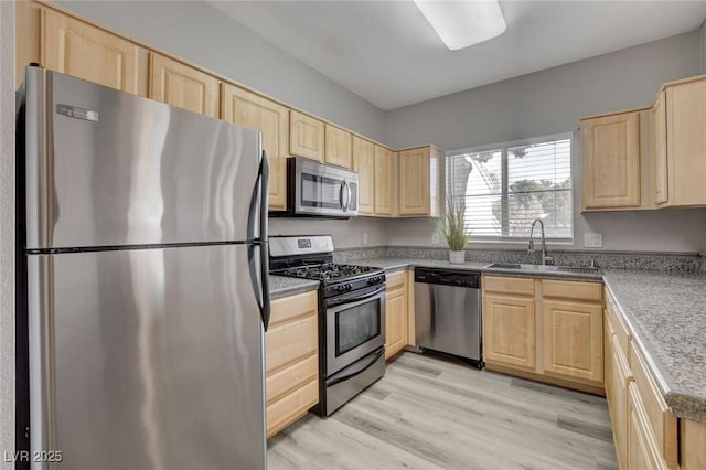 5250 S Rainbow Blvd Unit 2165, Las Vegas, NV 89118 - kitchen featuring appliances with stainless steel finishes, light brown cabinetry, and light wood-style floors