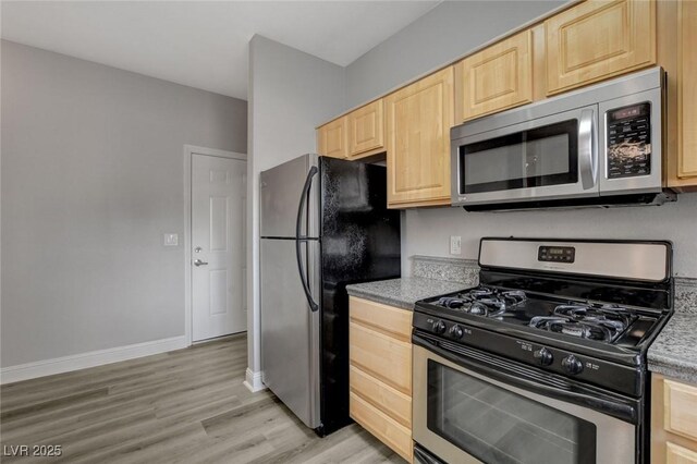 5250 S Rainbow Blvd Unit 2165, Las Vegas, NV 89118 - kitchen featuring stainless steel appliances, light brown cabinets, light wood finished floors, and light countertops