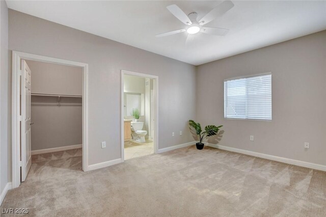 5250 S Rainbow Blvd Unit 2165, Las Vegas, NV 89118 - unfurnished bedroom featuring carpet, a walk in closet, a closet, and ensuite bathroom