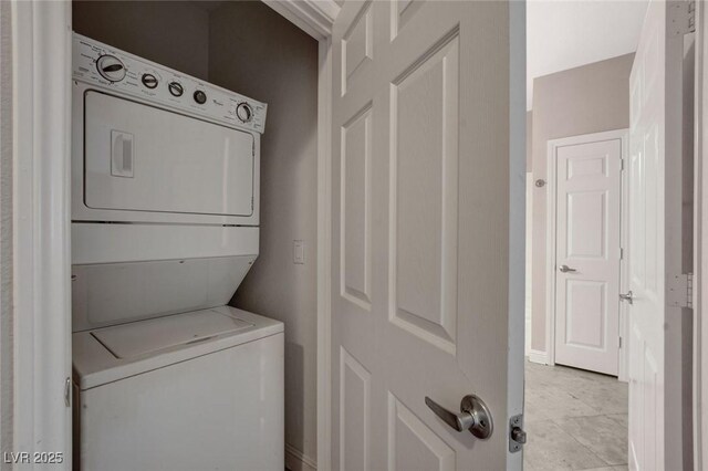 5250 S Rainbow Blvd Unit 2165, Las Vegas, NV 89118 - washroom featuring stacked washer / dryer and baseboards