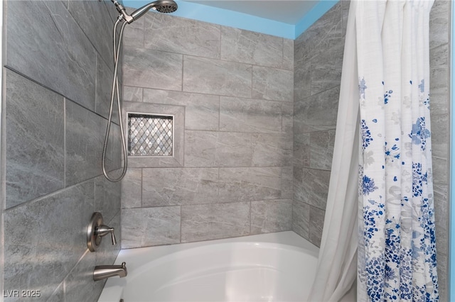 bathroom with shower / bath combination with curtain