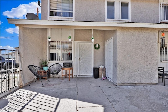 entrance to property with a patio area