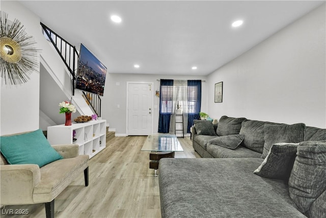 living room with light hardwood / wood-style flooring