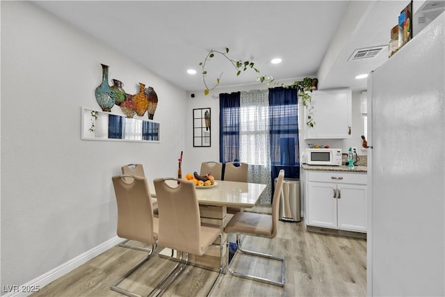 dining area featuring light hardwood / wood-style floors