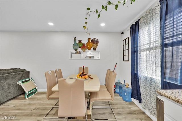 dining area with light wood-type flooring