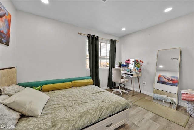 bedroom with light wood-type flooring