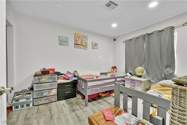 bedroom featuring light hardwood / wood-style flooring