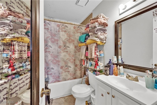 full bathroom featuring vanity, toilet, and shower / bath combo with shower curtain