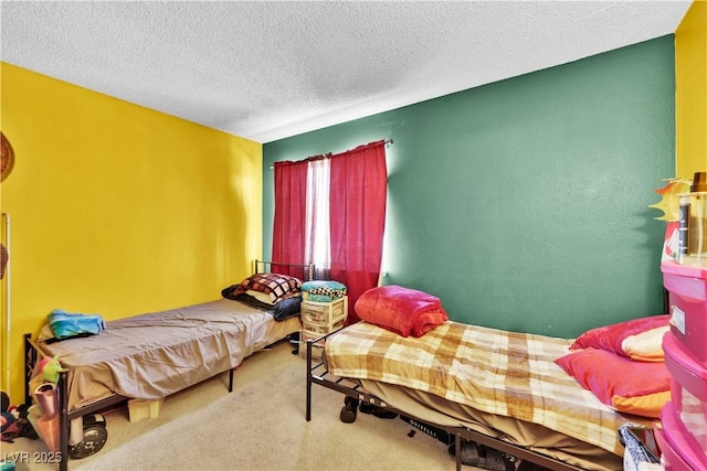 carpeted bedroom with a textured ceiling