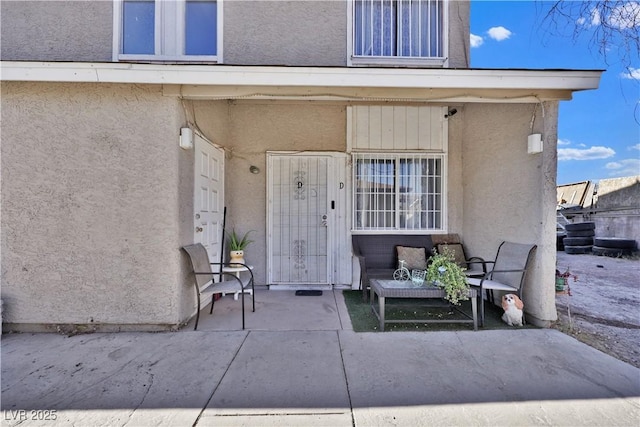 entrance to property with a patio area