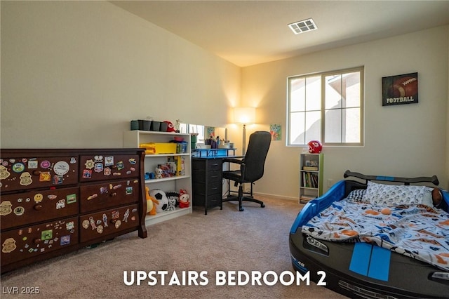 carpeted bedroom featuring visible vents and baseboards