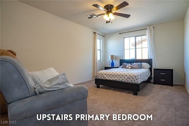 carpeted bedroom with ceiling fan and baseboards