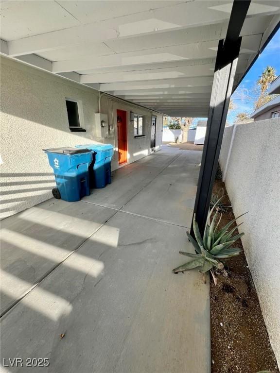 view of patio featuring fence