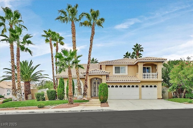 mediterranean / spanish-style house with a garage