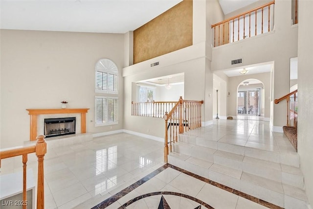 foyer entrance with a towering ceiling